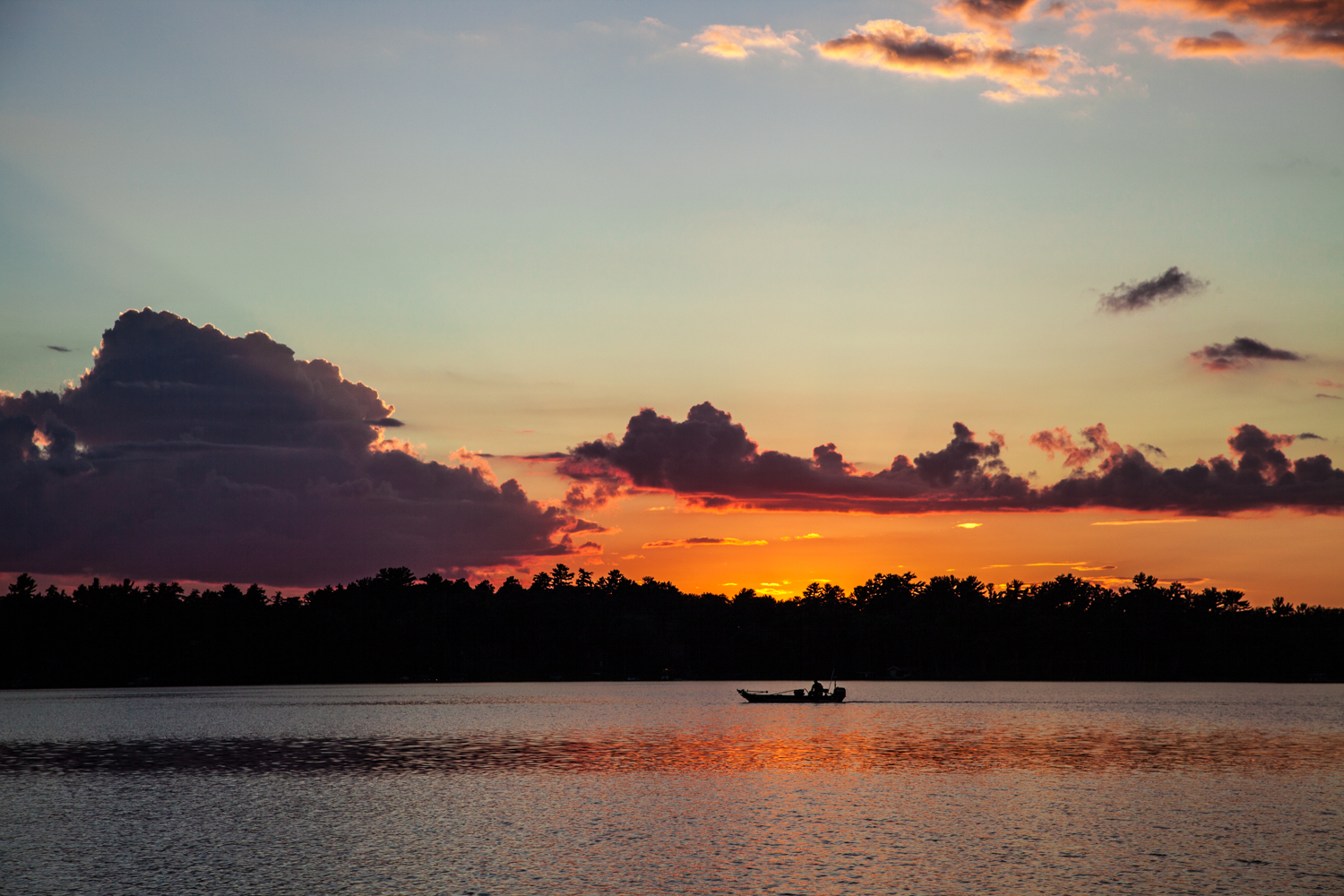 Sitting by the lake at sunset